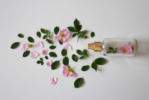 Roses with perfume bottle
